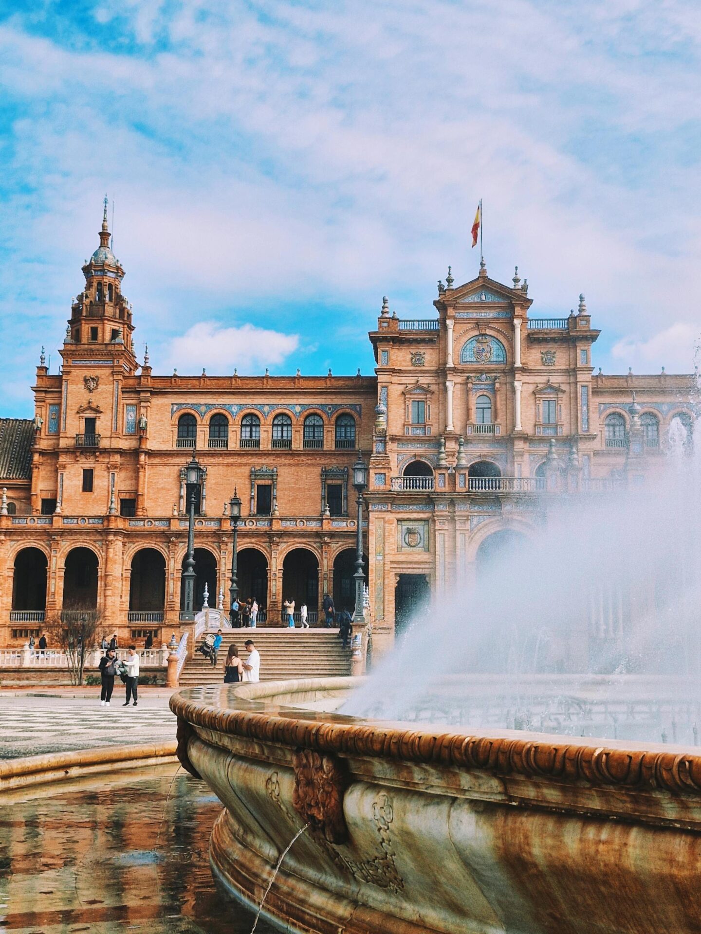 Explore the breathtaking architecture and vibrant atmosphere of Plaza de España in Seville.